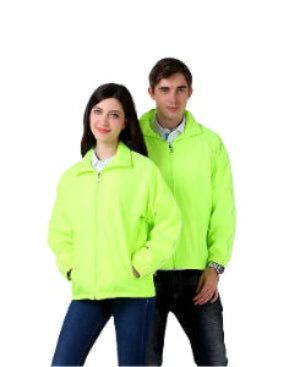 Two people wearing bright green jackets on a white background